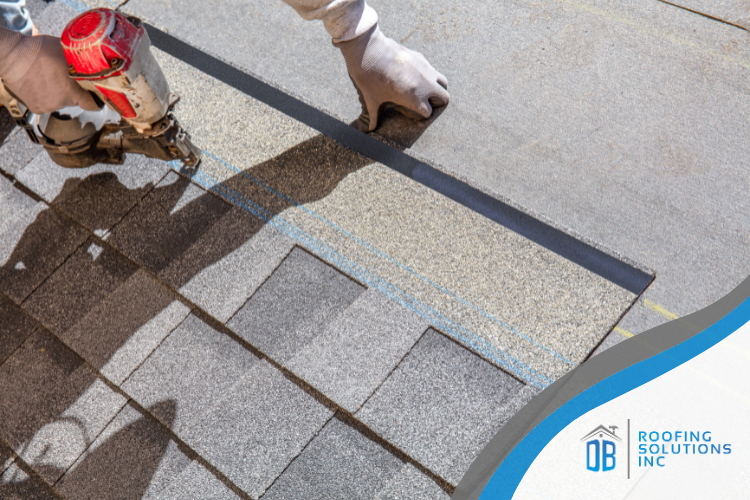 A Georgetown roofer inspecting roof materials during installation.